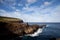 Easter Island rocky coast line under blue sky