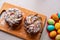 Easter Kraffin on a light background with colored, bright eggs. Cake with raisins, chocolate, nuts