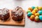 Easter Kraffin on a light background with colored, bright eggs. Cake with raisins, chocolate, nuts