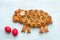 Easter lamb with poppy seeds, red colored eggs on a blue background