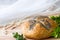 Easter loaf of bread with boxwood and rosary, easter religious concept