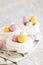 Easter meringue nests with colorful sweet eggs.