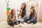 Easter - Mother and two daughters eat chocolate eggs