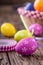 Easter. Multicolored easter eggs in a basket on a wooden table