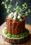 Easter Nest Cake with Speckled Eggs and Greenery. Easter dessert