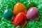 Easter nest with multicolored Paschal eggs, ready for an Easter egg hunt