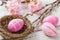 Easter nest with pink easter eggs on a wooden background