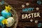 Easter nest on wood with lettering Happy Easter