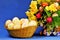 Easter painted eggs on a background of festive flowers . The Easter egg is a ceremonial food and a ritual symbol in Christian