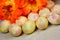 Easter painted eggs on a background of festive flowers. The Easter egg is a ceremonial food and a ritual symbol in Christian