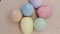 Easter pastel color eggs in bright color background.