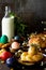 Easter pastries background. Colored eggs on a wooden table.