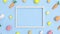 Easter pattern with eggs and carrots and copy space frame on bright pastel blue background. Stop motion flat lay