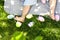 Easter photography, children& x27;s feet on the grass, colorful eggs, green lawn