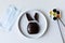 Easter problems due to covid-19-broken bunny, medical mask and paint brushes for decoration