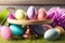 Easter product display table with easter eggs and spring meadow. Generative AI
