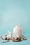 Easter quail eggs on pastel blue background