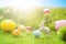 Easter rabbits on green grass with Easter eggs in Dreamland or fairy world