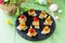 Easter recipe, festive appetizer. Canapes with pineapple, grill chicken, marinated peppers - on the festive table