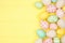 Easter side border with modern farmhouse cloth and pastel eggs over a yellow wood banner background