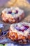 Easter Sponge cake nest. Nuts and oval sweet sweets in the form of eggs. Beautiful blurred background. Decoration for the holiday
