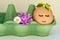 Easter or spring creative concept with cute egg and fresh spring vegetation