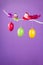 Easter or spring purple background - birds and eggs on a twig