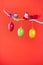 Easter or spring red background - birds and eggs on a twig