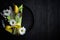 Easter spring table dishware composition with yellow tulip flower