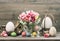 Easter stillife. tulip flowers and colored eggs