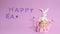 Easter stop motion animation. Beautiful Easter bunny is moving in the frame, a plasticine inscription Happy Easter