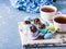 Easter sweet cup cakes treets in egg shell on blue