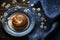 Easter Table Decor. Spring Flowers, Pastries and Dark Blue Tablecloth - Top View, Flat Lay