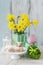 Easter table with lamb cake, bouquet of daffodils and painted eggs