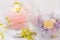 Easter table setting, details, chocolate eggs in elegant glass, candle, flowers