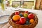 Easter tablewear outdoor under the pergola with colorful eggs in a sunny day