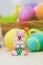 Easter toy bunny with colored eggs