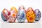 Easter tradition. Handmade painted chicken eggs on a white background.