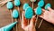 Easter treats woman turquoise icing egg biscuits