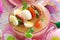 Easter white borscht with quail eggs and sausage in pink glass