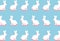 Easter white bunny flat lay pattern on bright blue background with hard shadows, wallpaper, greeting card