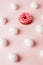 Easter white eggs repetition with shadow and pink donut on pink pastel background, system error, copy space, trendy background