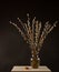 Easter Willow bouquet with colorful decorations in vase isolated on black background, copy space