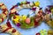 Easter wreath with Easter eggs, baby chicken and easter decorations.