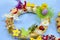 Easter wreath with Easter eggs, baby chicken and easter decorations.