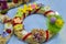 Easter wreath with Easter eggs, baby chicken and easter decorations.