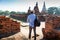 Eastern Asia summer holidays. Caucasian man tourist from back looking at Wat Chaiwatthanaram temple. Tourist travel in the morning