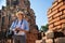 Eastern Asia summer holidays. Caucasian man tourist from back looking at Wat Chaiwatthanaram temple. Travelers take pictures with