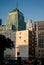 Eastern Columbia Lofts in a bustling cityscape featuring tall skyscrapers