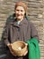 Eastern european senior farmer woman holding eggs